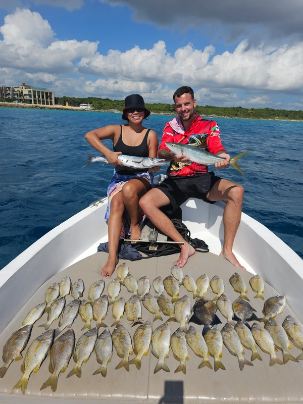 Anglers with fresh catch in Playa del Carmen